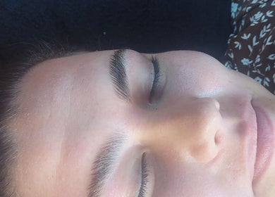 Person enjoying facial treatment at Natural Beauty Salon And Spa, Hoedspruit, Gauteng, ZA.