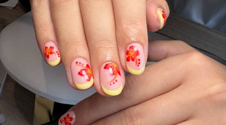 Vibrant floral nail art design at Create By Chloe, Bishopbriggs, Scotland, GB. Perfect for beauty enthusiasts.