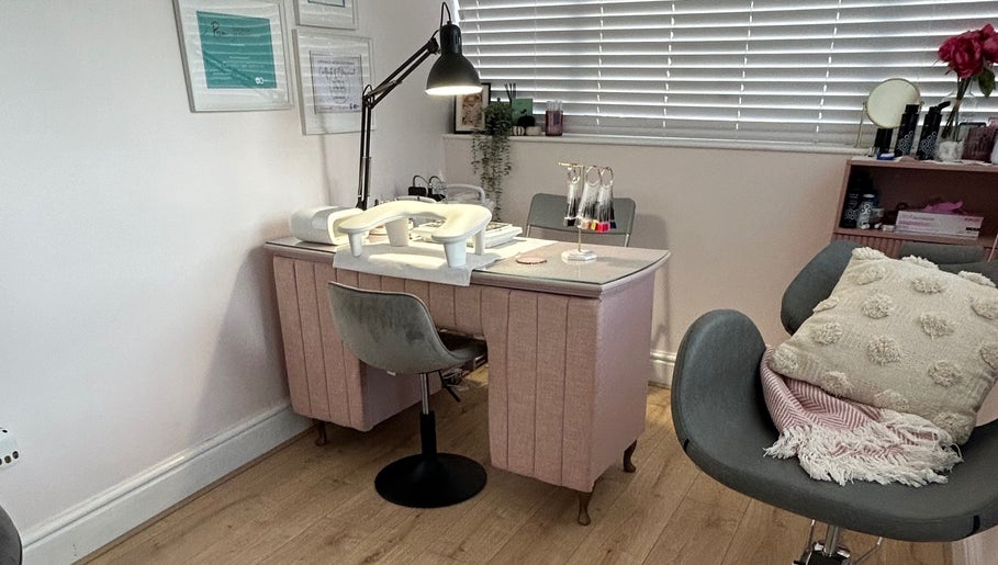 Elegant nail station at Beauty in the Peak, High Peak, England, GB, with cozy chairs and vibrant decor.