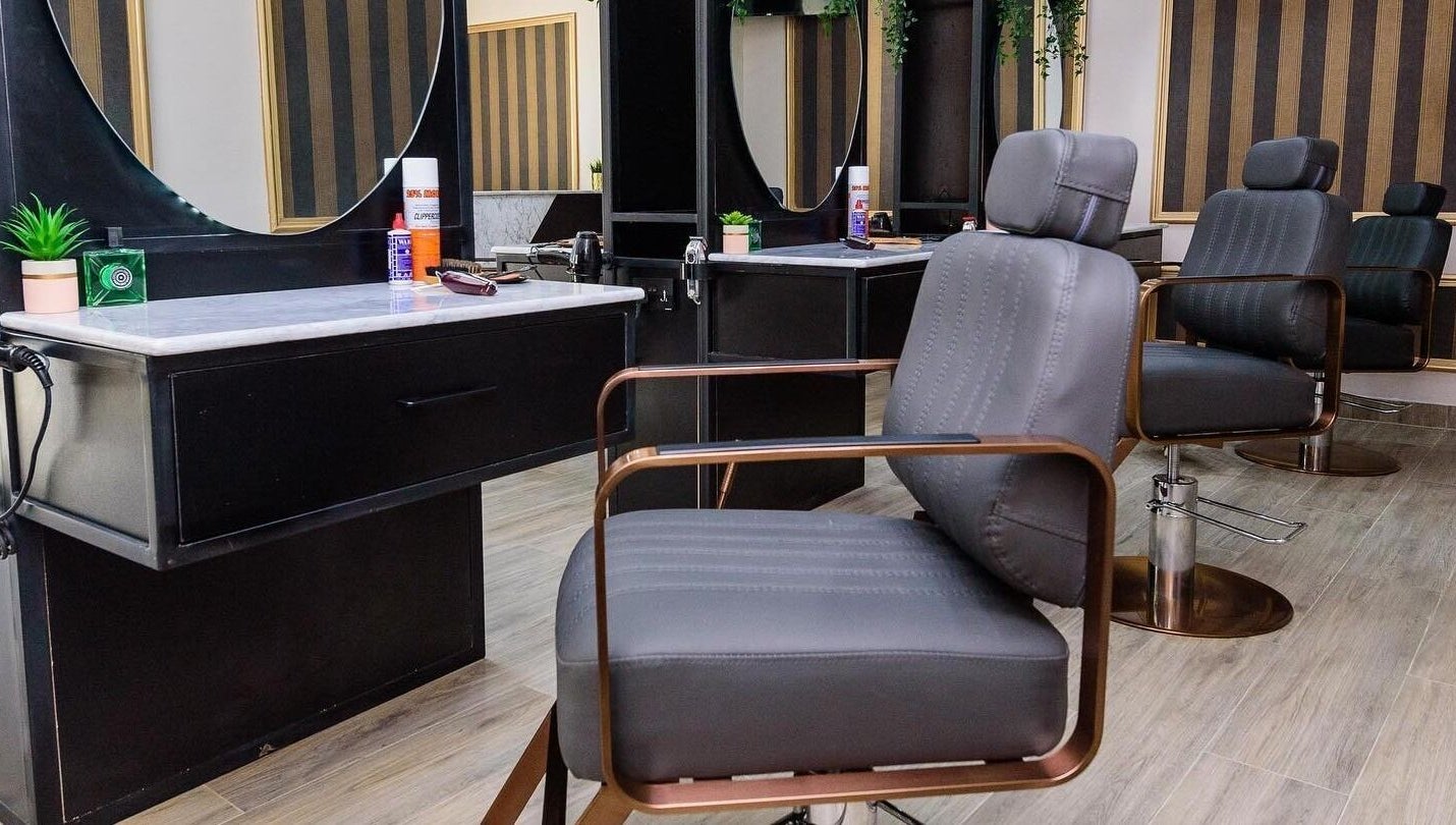 Modern salon chairs and styling stations at Groomed by Elereka Ikoyi in Lagos, Lagos, NG offer a sleek experience.