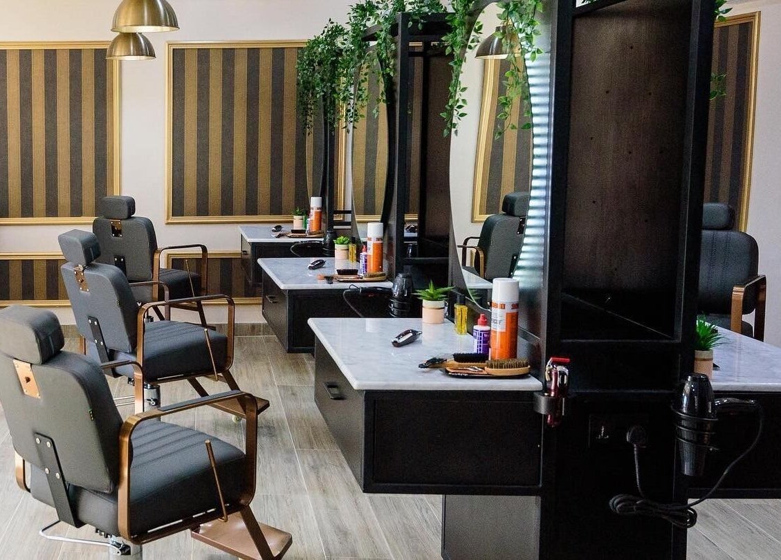 Chic interior of Groomed by Elereka Ikoyi, Lagos, Lagos, NG featuring modern styling chairs and mirrors.