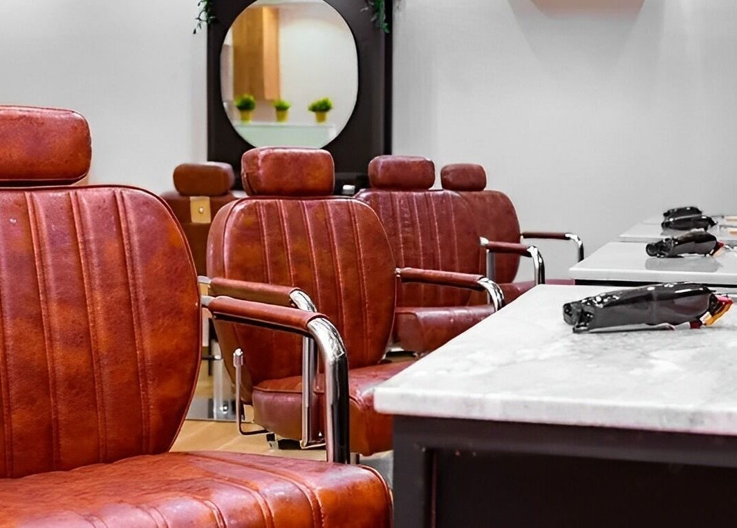 Luxurious leather styling chairs at Groomed By Elereka Lekki, located in Lekki, Lagos, NG for premium grooming.
