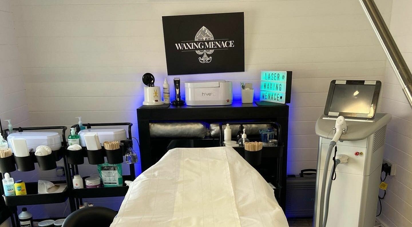 Modern treatment room at The Waxing Menace, Stevenage, England, GB, featuring sleek equipment and decor.