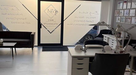 Cozy interior of AM Beauty in Kingswinford, England, showcasing elegant beauty workstations and modern aesthetics.