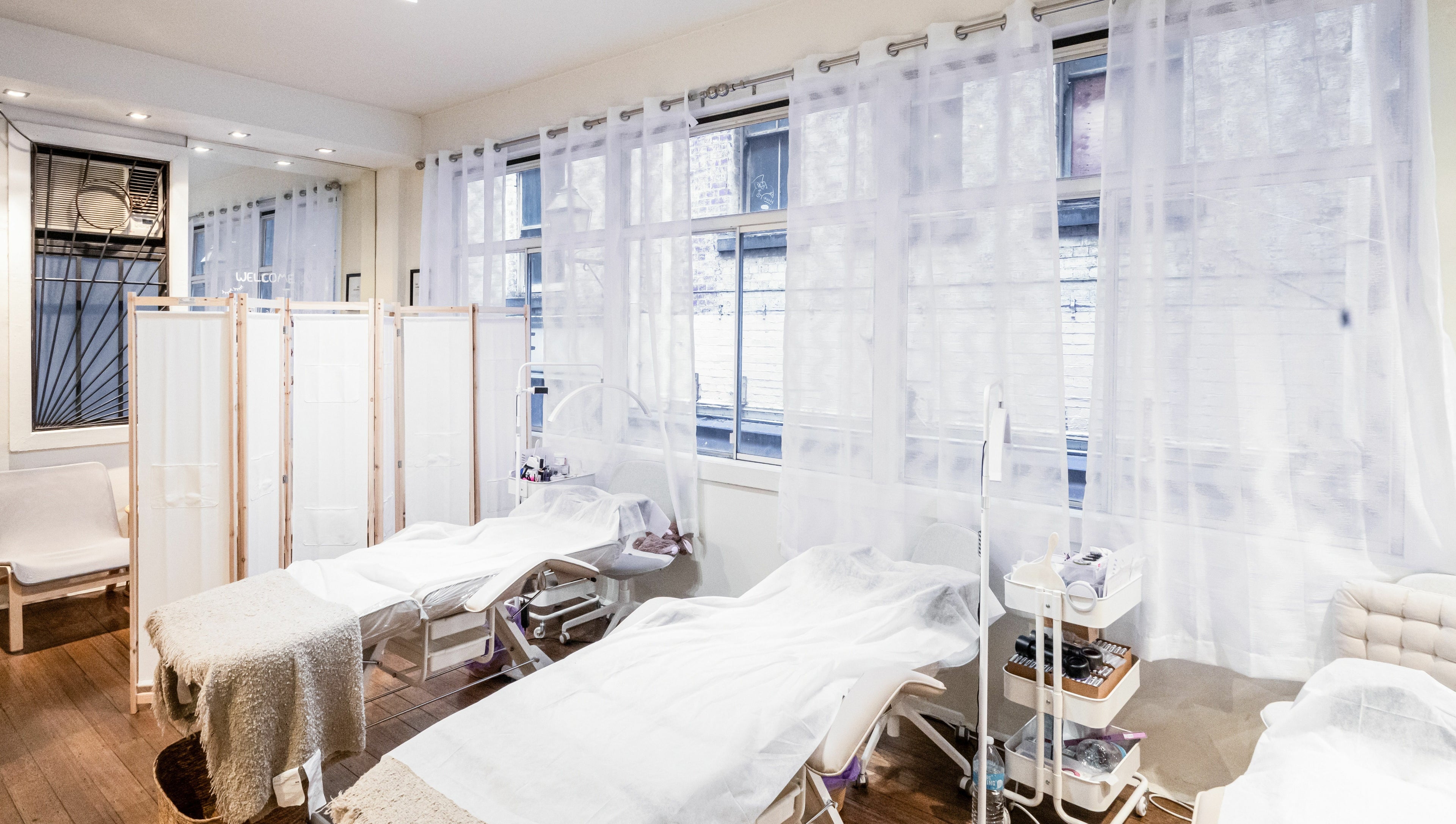 Serene treatment room at Lalulash.beauty in Melbourne, Victoria, AU featuring cozy beds and natural light.