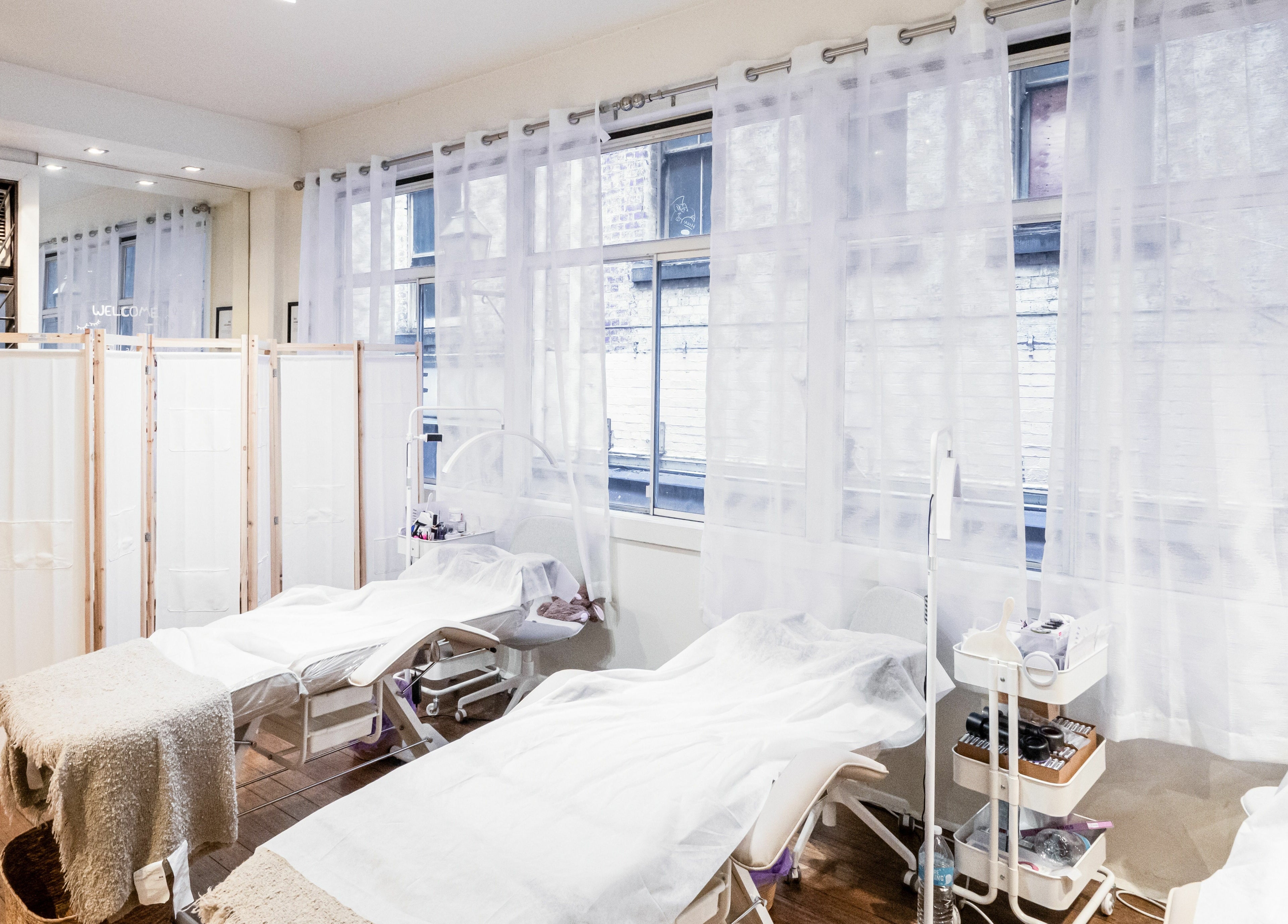 Serene treatment room at Lalulash.beauty in Melbourne, Victoria, AU featuring cozy beds and natural light.