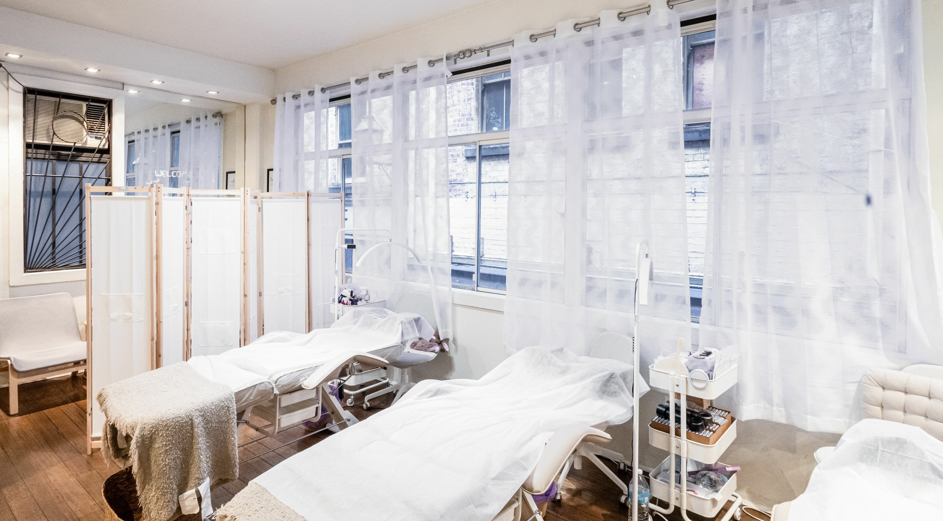 Serene treatment room at Lalulash.beauty in Melbourne, Victoria, AU featuring cozy beds and natural light.