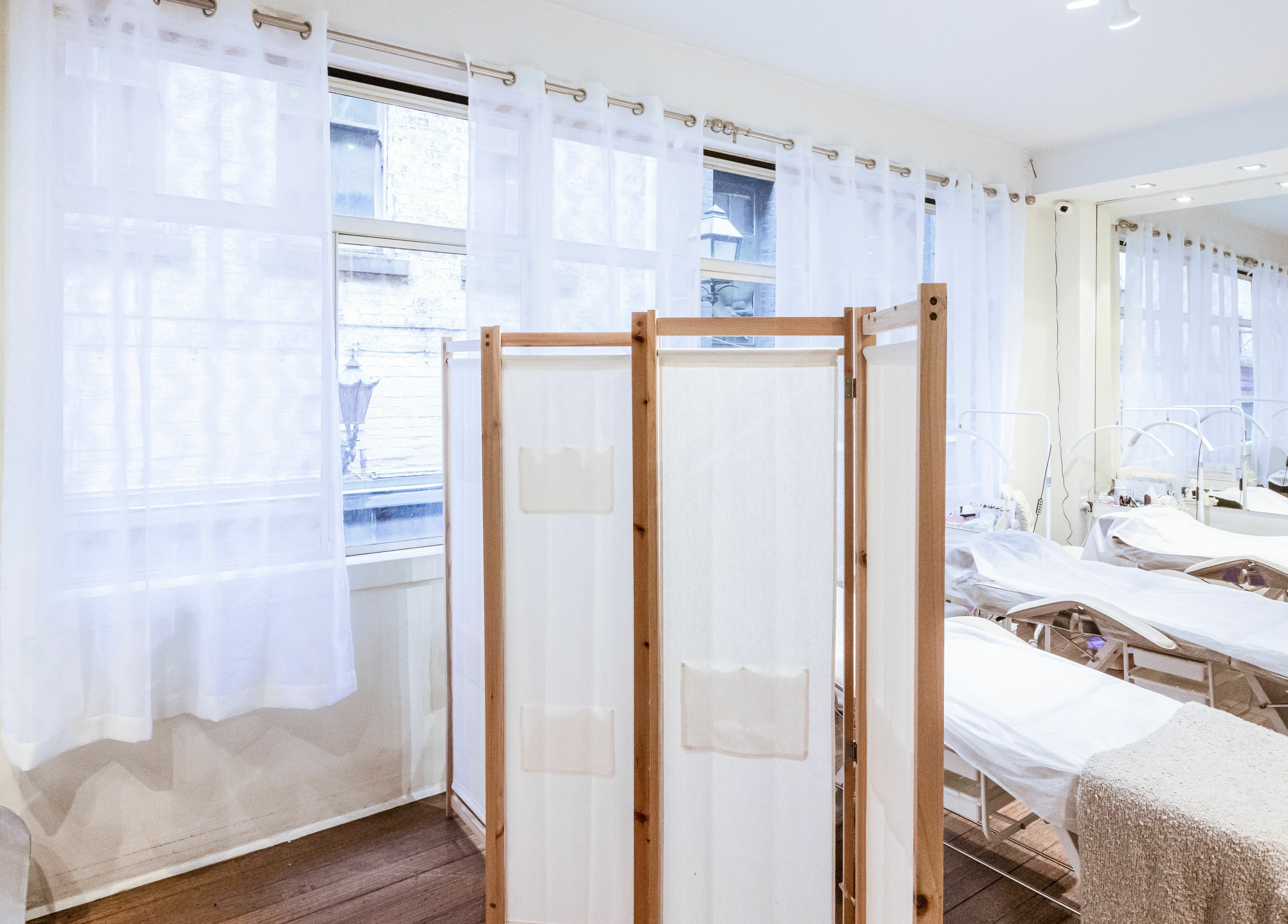 Elegant interior of Lalulash.beauty in Melbourne, Victoria, AU featuring cozy treatment beds and soft lighting.