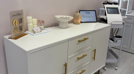 Chic reception area at Redefine Body Contouring in Poynton, Cheshire, England with modern decor.