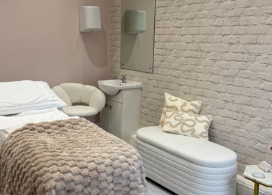 Relaxing treatment room at Redefine Body Contouring, Poynton, Cheshire, England, GB, featuring plush decor.