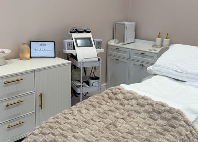 Relaxing treatment room at Redefine Body Contouring in Poynton, Cheshire, England, GB showcasing modern equipment.