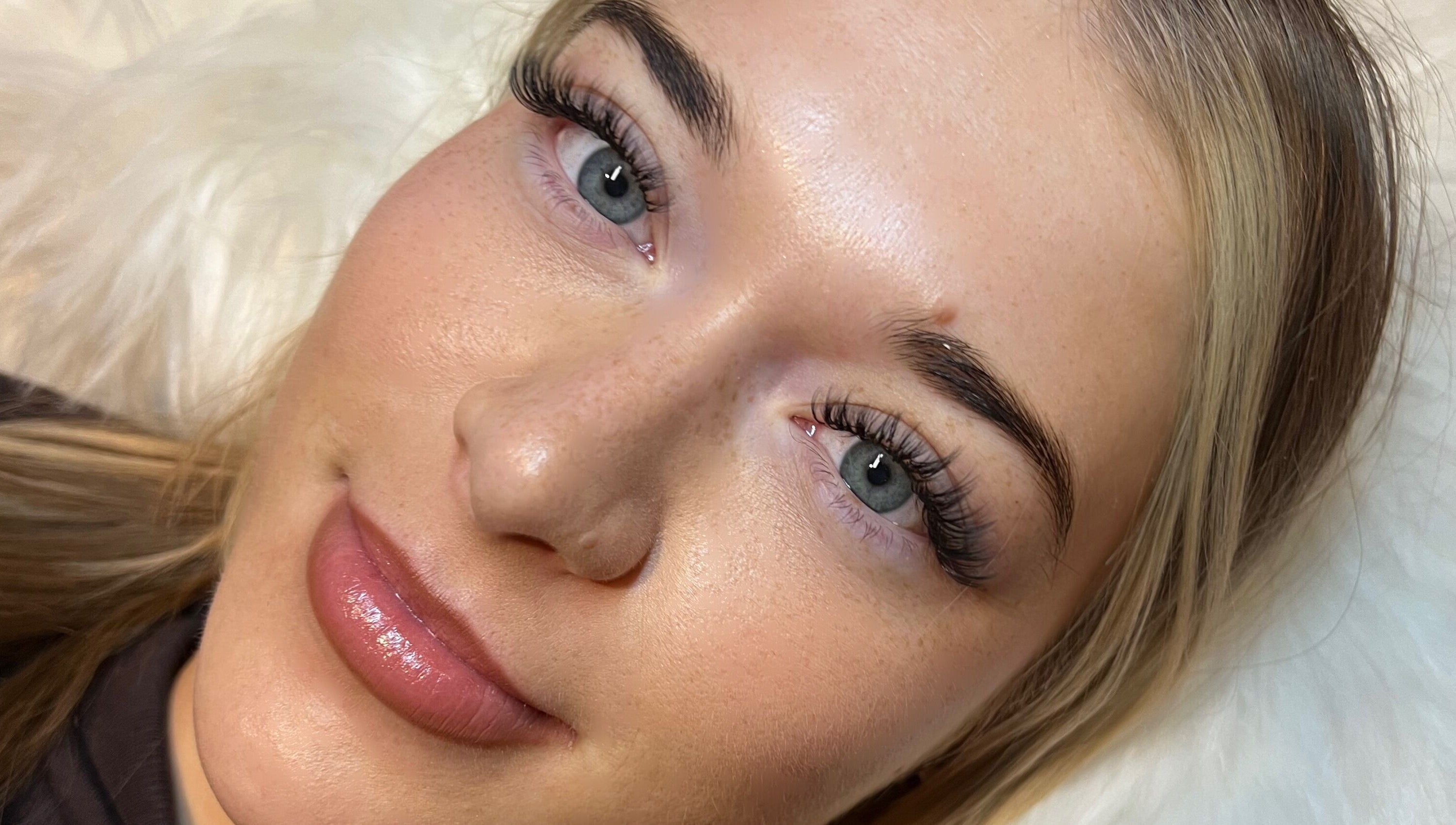 Close-up of woman's enhanced eyelashes at AZlash Reading, Reading, England, GB.