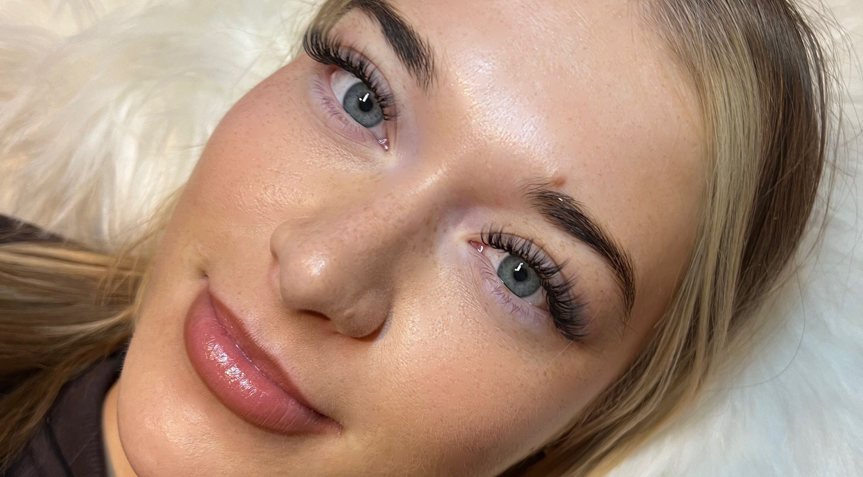 Close-up of woman's enhanced eyelashes at AZlash Reading, Reading, England, GB.