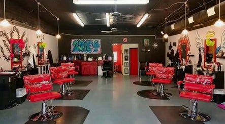 Stylish salon interior with red chairs at Pampered by Anie, Yukon, Oklahoma, US.