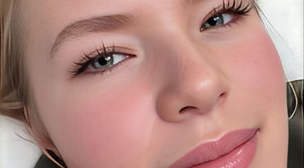 Close-up of a serene face showcasing flawless skin at Pampered by Anie, Yukon, Oklahoma, US.