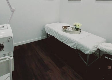 Calm massage room at Mica Spa Wellness, Vaughan, Ontario, CA, showcasing a cozy massage table and gentle lighting.