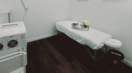 Calm massage room at Mica Spa Wellness, Vaughan, Ontario, CA, showcasing a cozy massage table and gentle lighting.