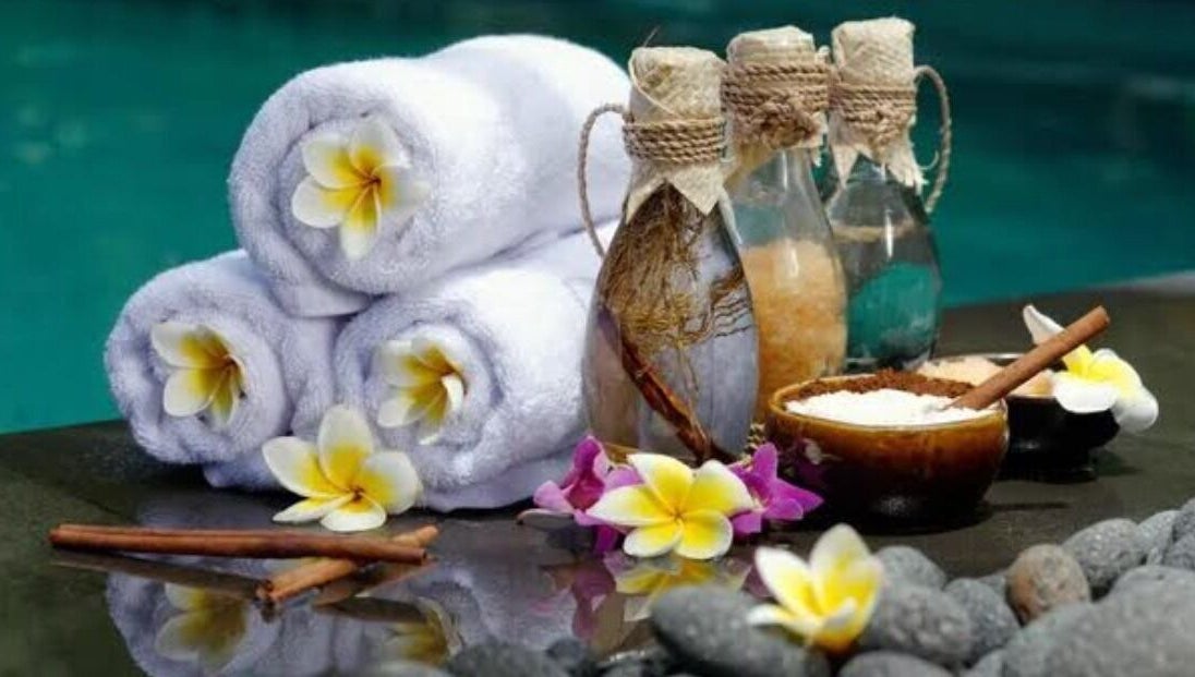 Relaxing spa setup with towels, flowers, and oils at Mica Spa Wellness, Vaughan, Ontario, CA.