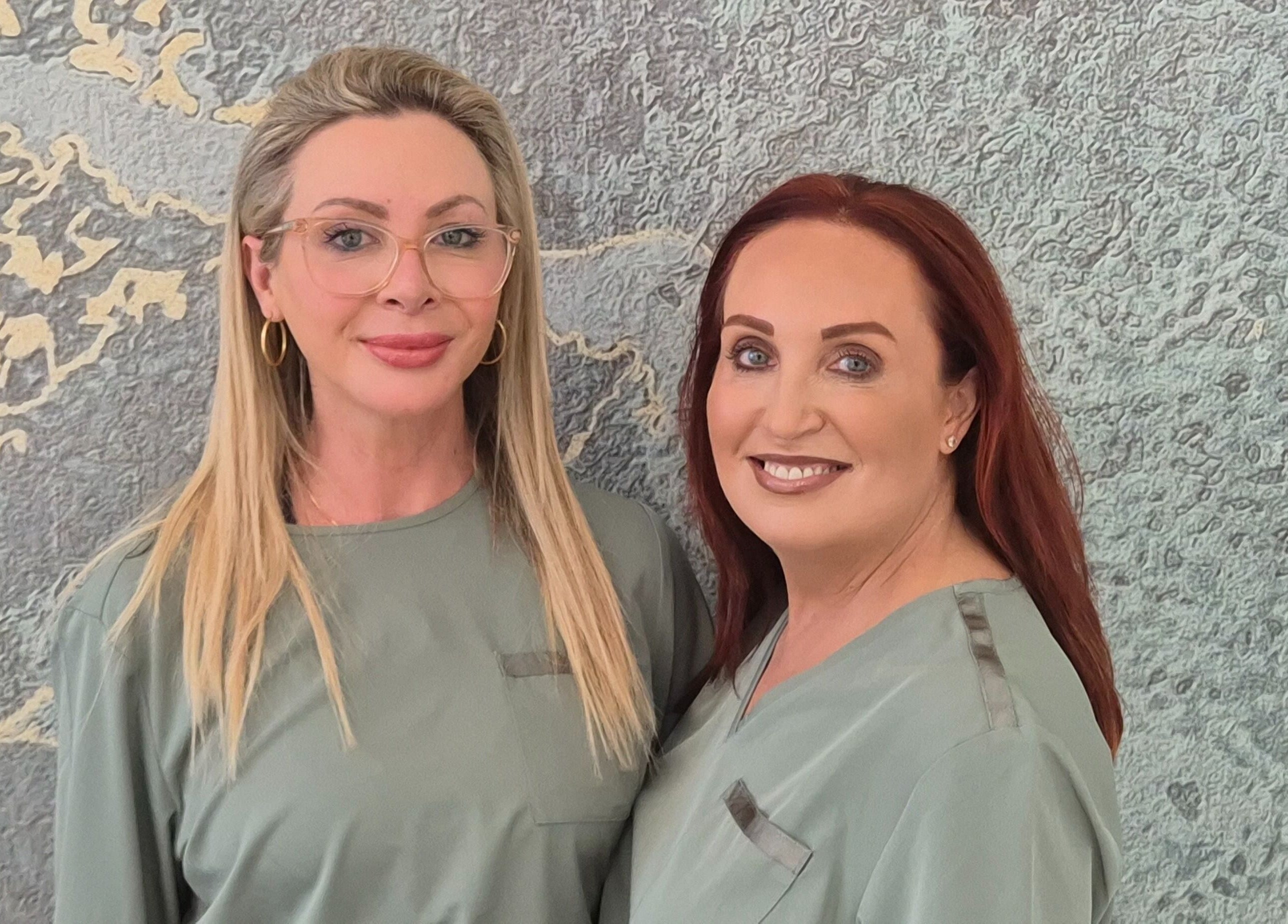 Team members at The Retreat Room At Glo Medispa, Grantham Farm, New South Wales, AU, smiling together.