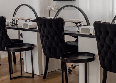 Luxurious nail station with black chairs at Melly's Beauty Parlour, Newstead, Queensland, AU.