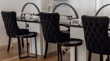 Luxurious nail station with black chairs at Melly's Beauty Parlour, Newstead, Queensland, AU.