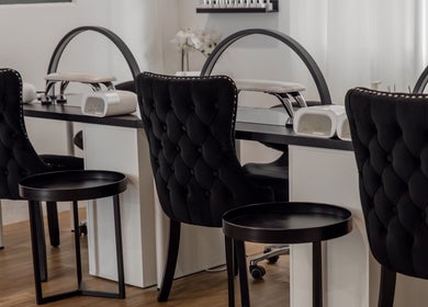 Chic nail stations at Melly's Beauty Parlour in Newstead, Queensland, AU, offering luxurious beauty services.