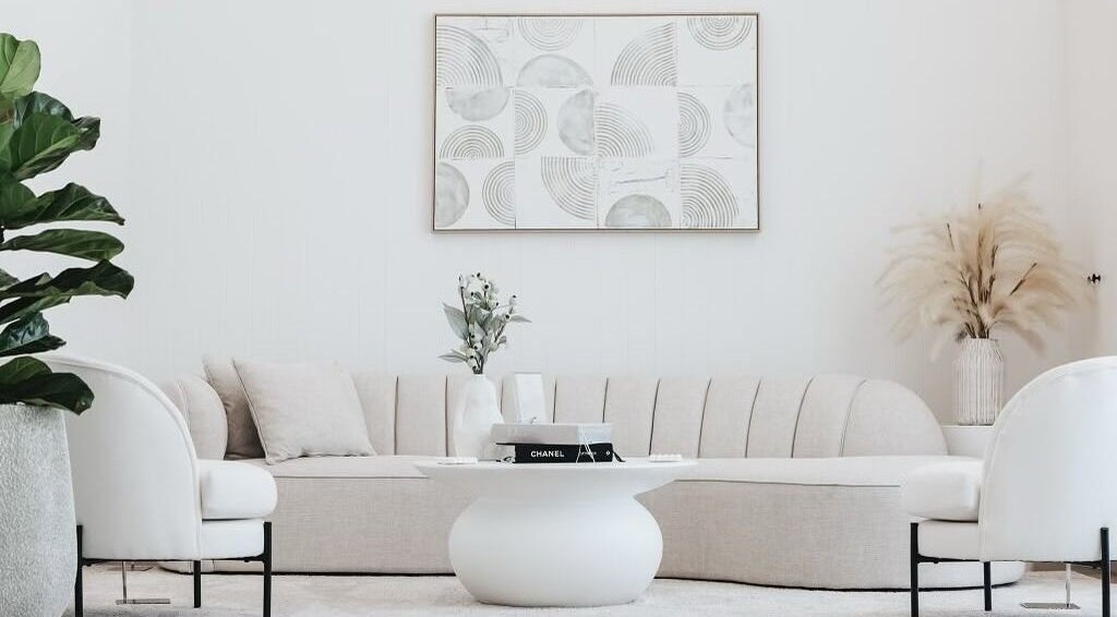 Elegant lounge at Snatched Clinic, Labrador, Queensland, AU featuring modern decor and comfy seating.