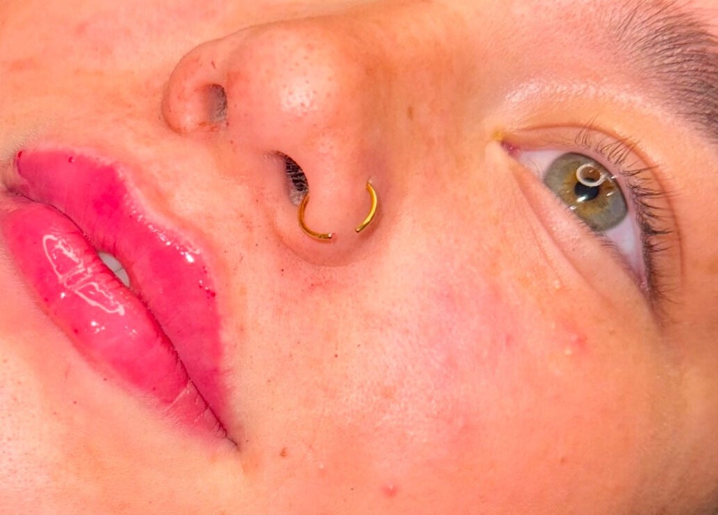 Close-up of glossy lips and eye at Lashmek, Edinburgh, Scotland, GB, showcasing beauty service results.
