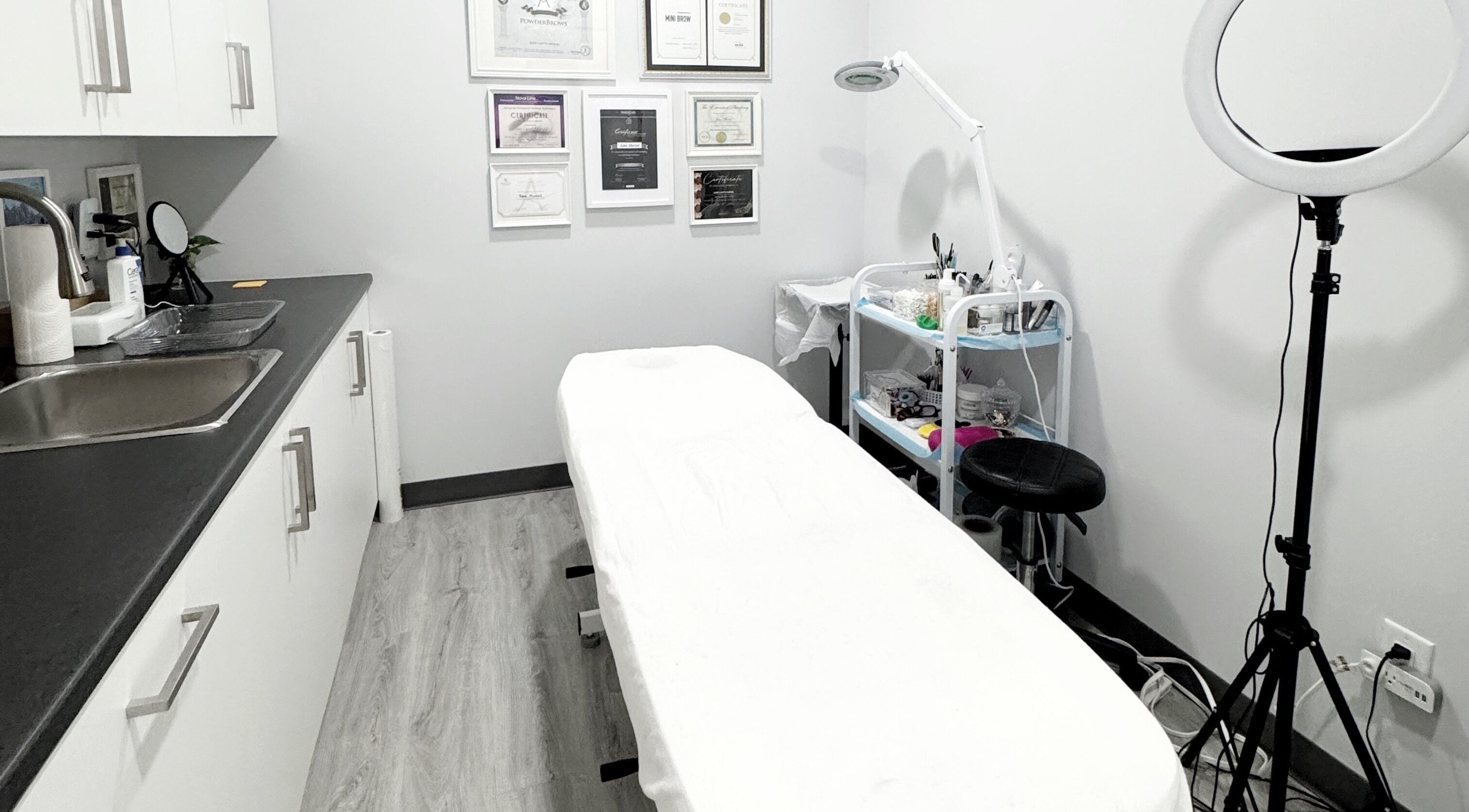 Inviting treatment room at JM Permanent Makeup in Edmonton, Alberta, CA with cozy decor and modern amenities.