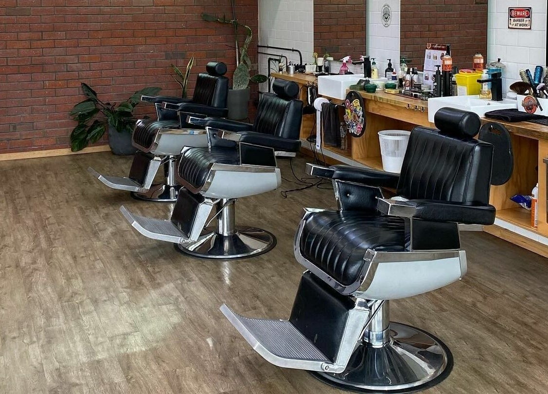 Elegant barbershop chairs at Eastside, Camberwell, VIC, AU with modern amenities and rustic decor.