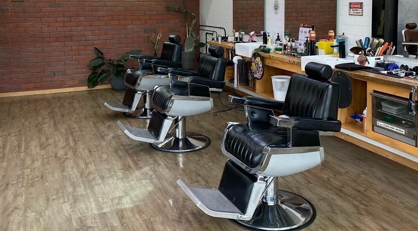Elegant barbershop chairs at Eastside, Camberwell, VIC, AU with modern amenities and rustic decor.