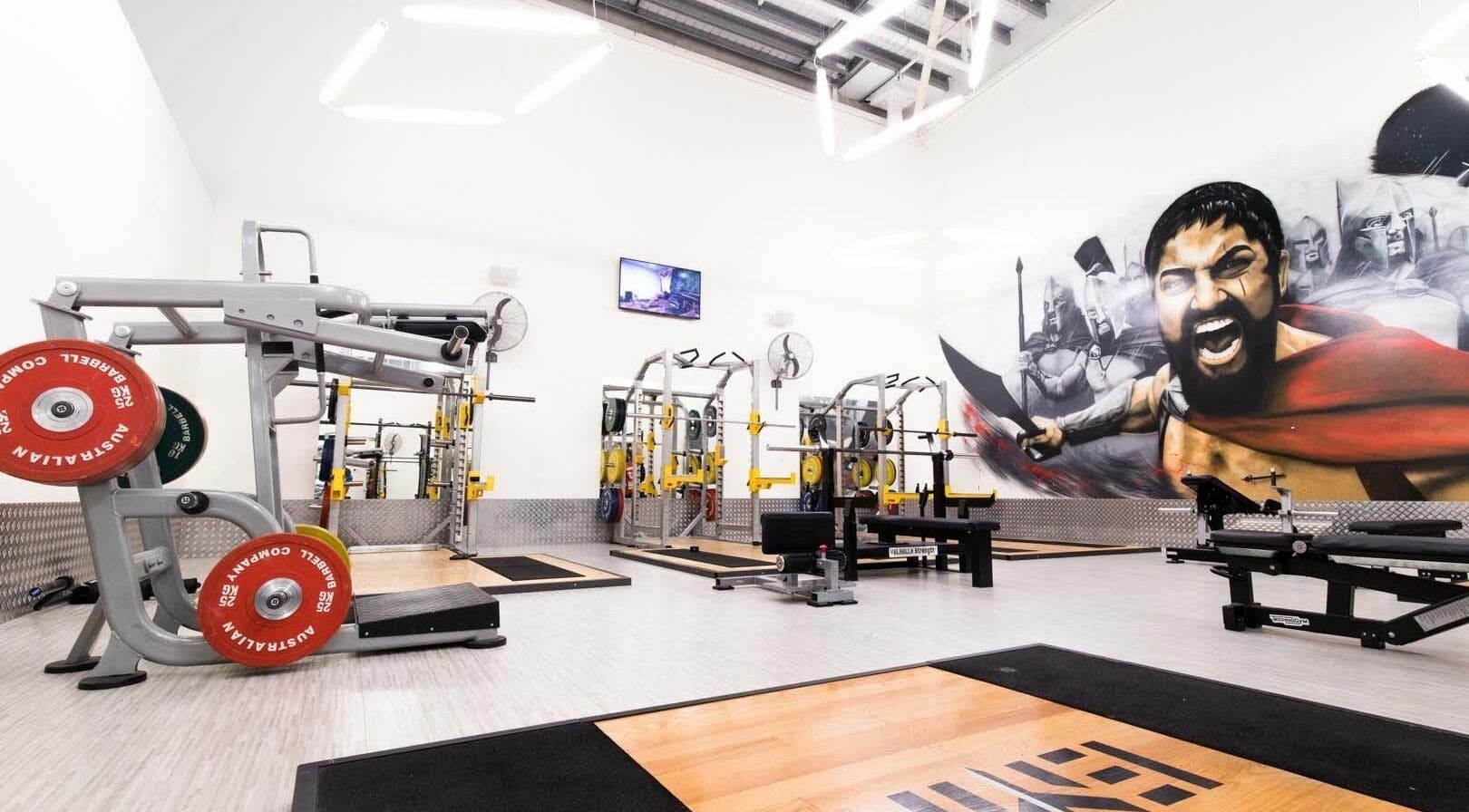 EMF Performance Centre | Coomera gym with modern equipment in Upper Coomera, Queensland, AU boasting a Spartan mural.
