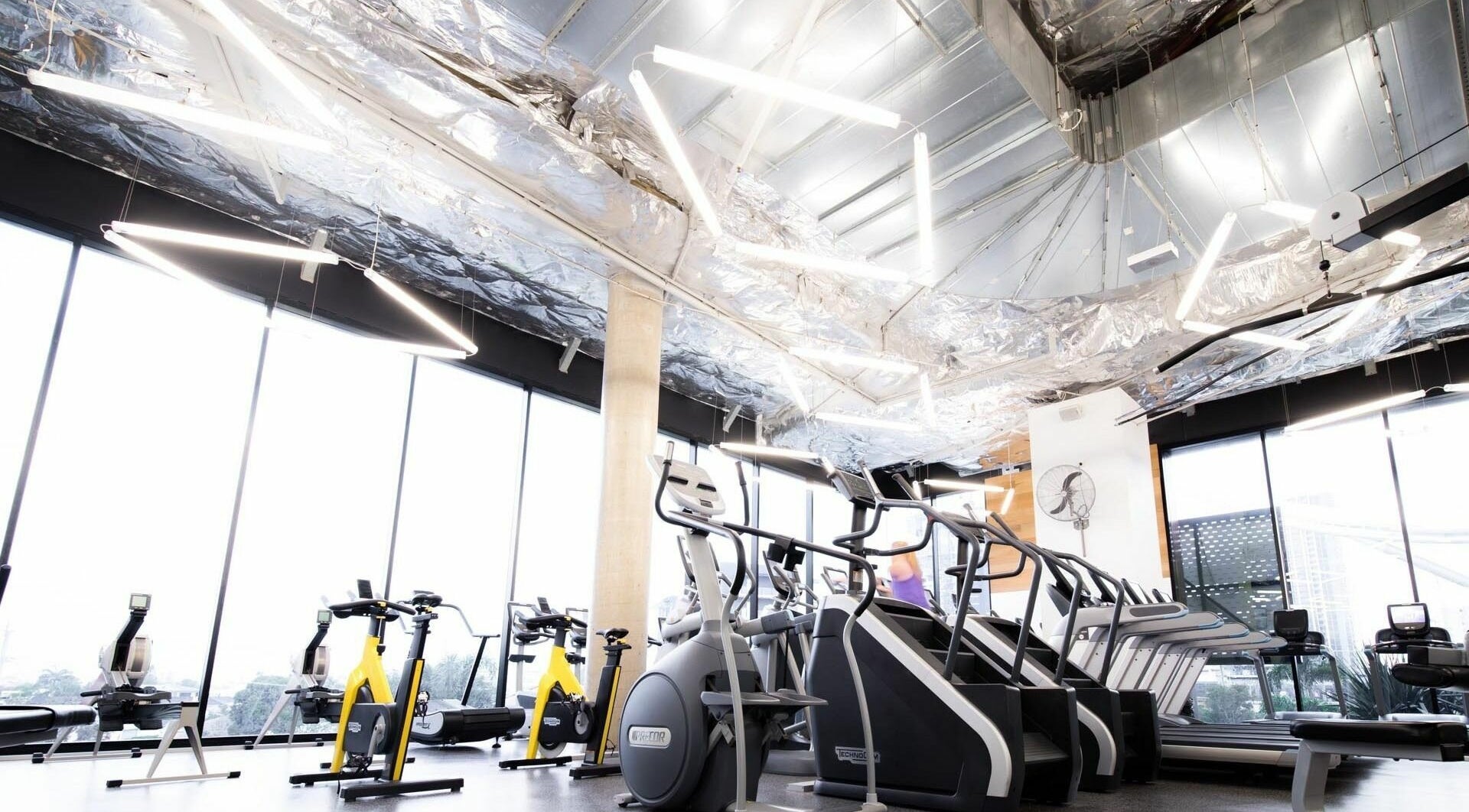 Bright fitness area at EMF Fitness Centre | Pacific Fair, Broadbeach Waters, Queensland, AU with exercise equipment.