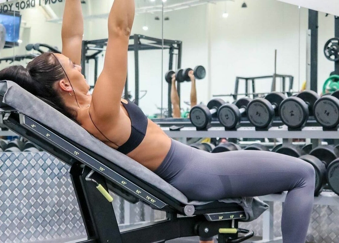 Woman lifting weights at EMF Performance and Recovery Centre | Springfield Central, Queensland, AU.