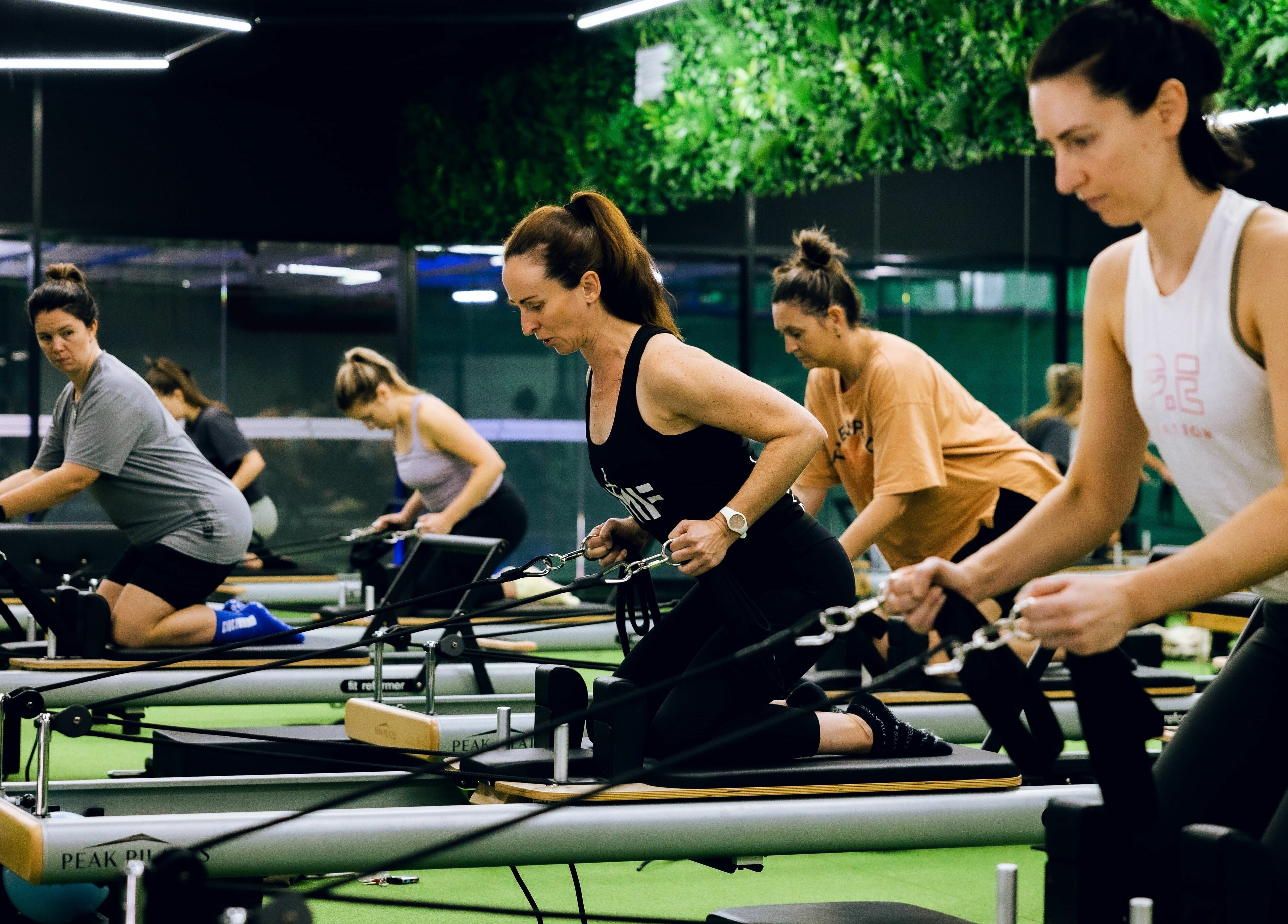 Individuals engage in reformer Pilates at EMF Performance and Recovery Centre | Miranda, New South Wales, AU.