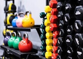 Bright kettlebells and dumbbells at EMF Performance and Recovery Centre | Nerang in Highland Park, Queensland, AU.