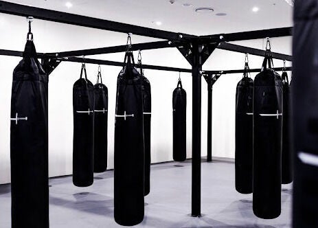 Punching bags hanging at EMF Performance and Recovery Centre | Nerang, located in Highland Park, Queensland, AU.