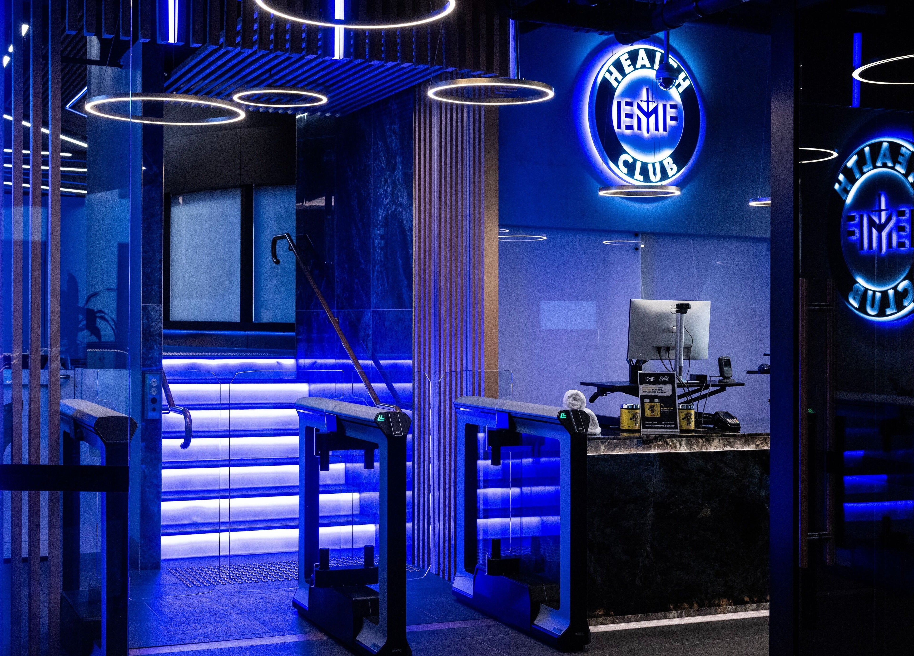 Entrance of EMF Health Club | Circular Quay in Sydney, New South Wales, AU with vibrant neon lighting.