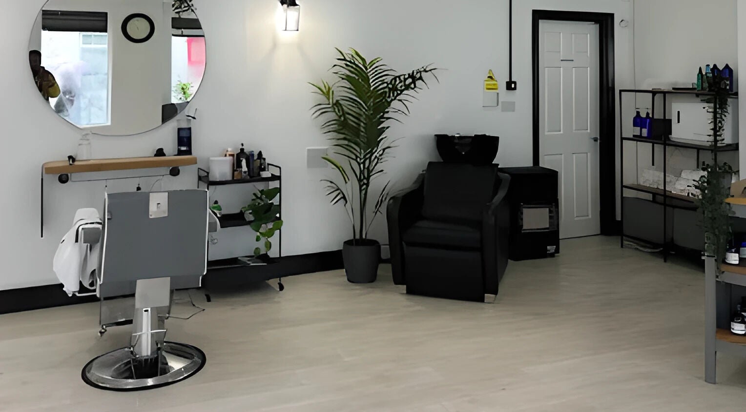 Modern interior of Nobleman's Barbershop Newbridge, County Kildare, IE showcasing sleek decor and comfortable seating.