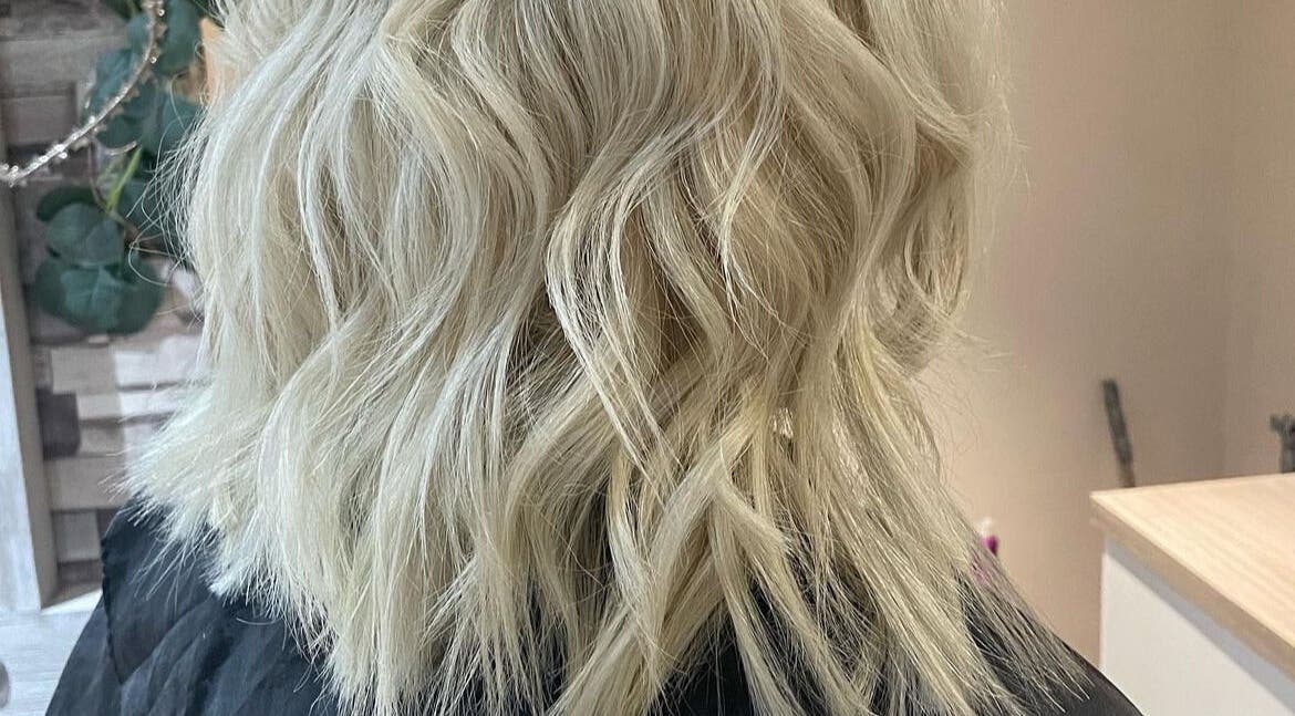 Stylish blonde waves at Hair by Rosie, Bristol, England, GB. Perfect blend of color and texture.