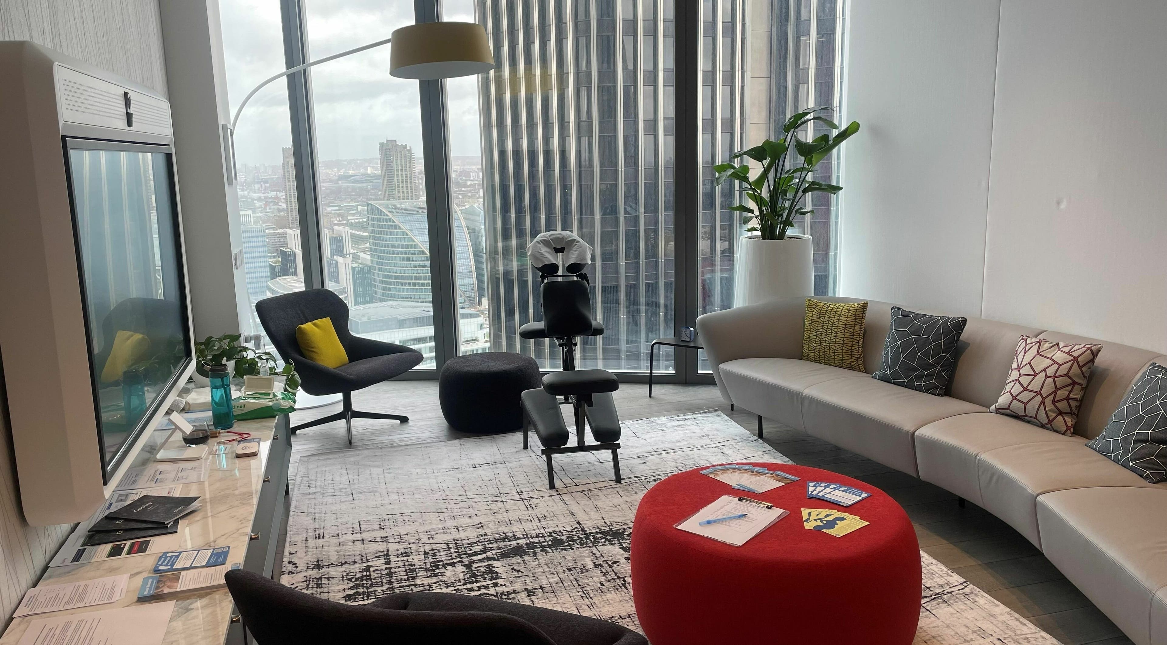 Modern massage room at Waves Massage at Cooley (UK) LLP - EMPLOYEES ONLY in London, England with city views.