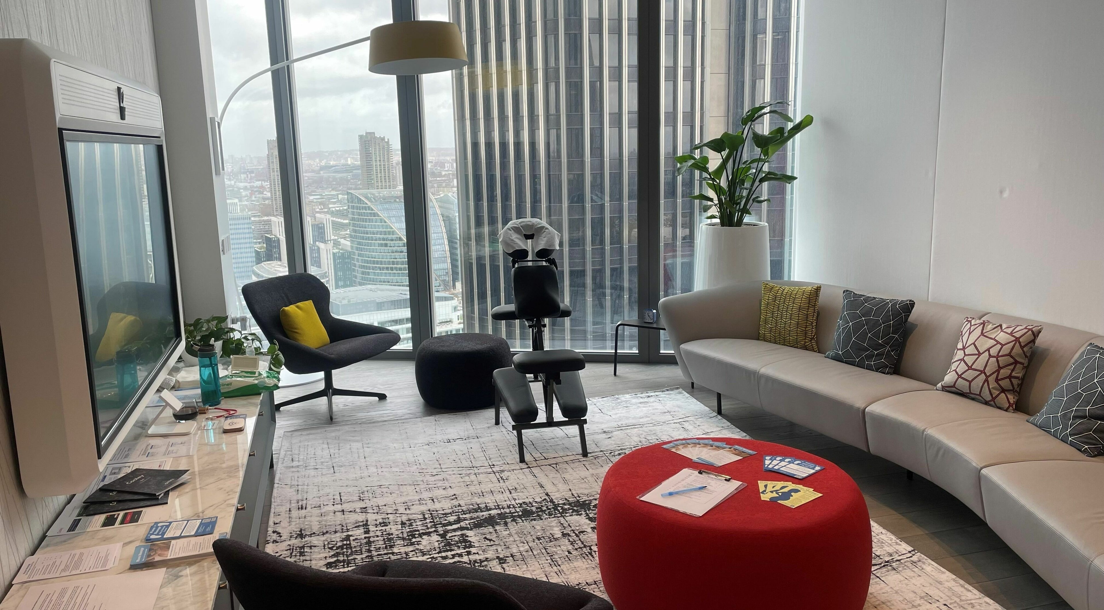 Modern massage room at Waves Massage at Cooley (UK) LLP - EMPLOYEES ONLY in London, England with city views.