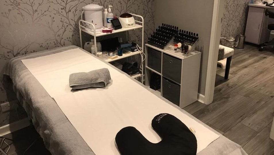 Calming treatment room at Jodie's Beauty & Aesthetics Lounge, Lancaster, England, GB, featuring a massage bed.