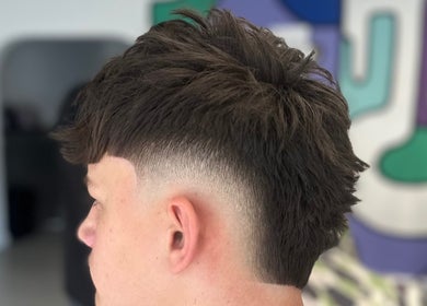 Close-up of a stylish fade haircut at Blades Barbers, Hereford, England, GB.
