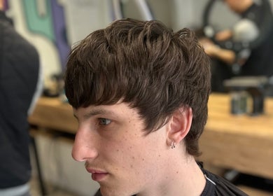 Close-up of a trendy haircut at Blades Barbers in Hereford, England, GB, showcasing modern styling.