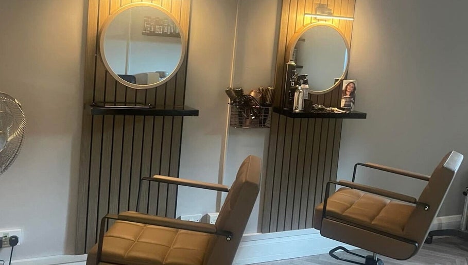 Modern salon setup at Lebeau, Bridgnorth, England, GB with stylish mirrors and chairs.