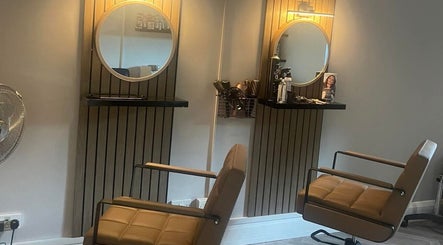 Modern salon setup at Lebeau, Bridgnorth, England, GB with stylish mirrors and chairs.