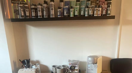 Lebeau beauty products display on shelf in Bridgnorth, England, GB. Coffee station below for client comfort.