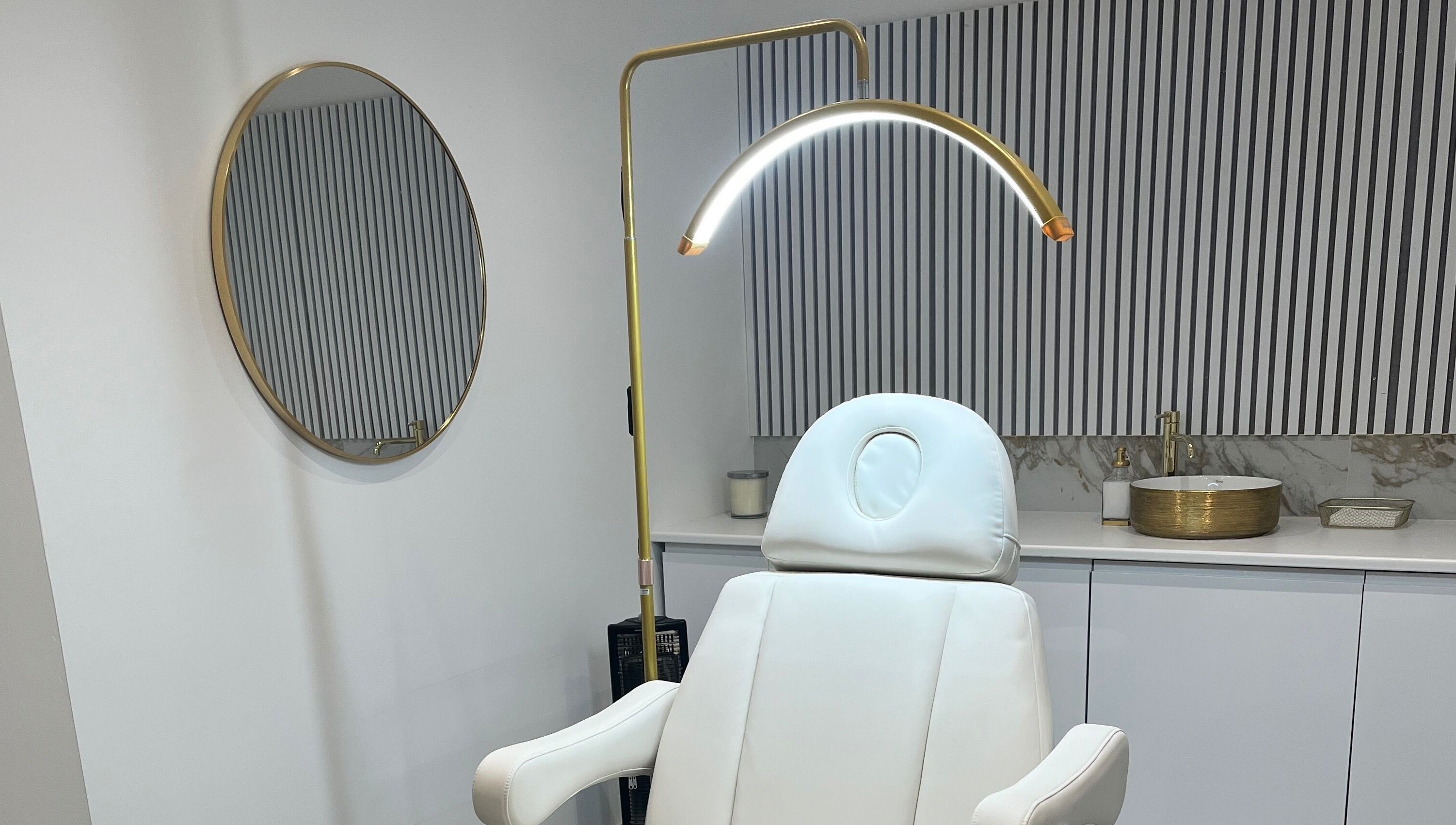 Modern treatment room at Renaissance Aesthetics, Sligo, County Sligo, IE with stylish decor and comfortable chair.