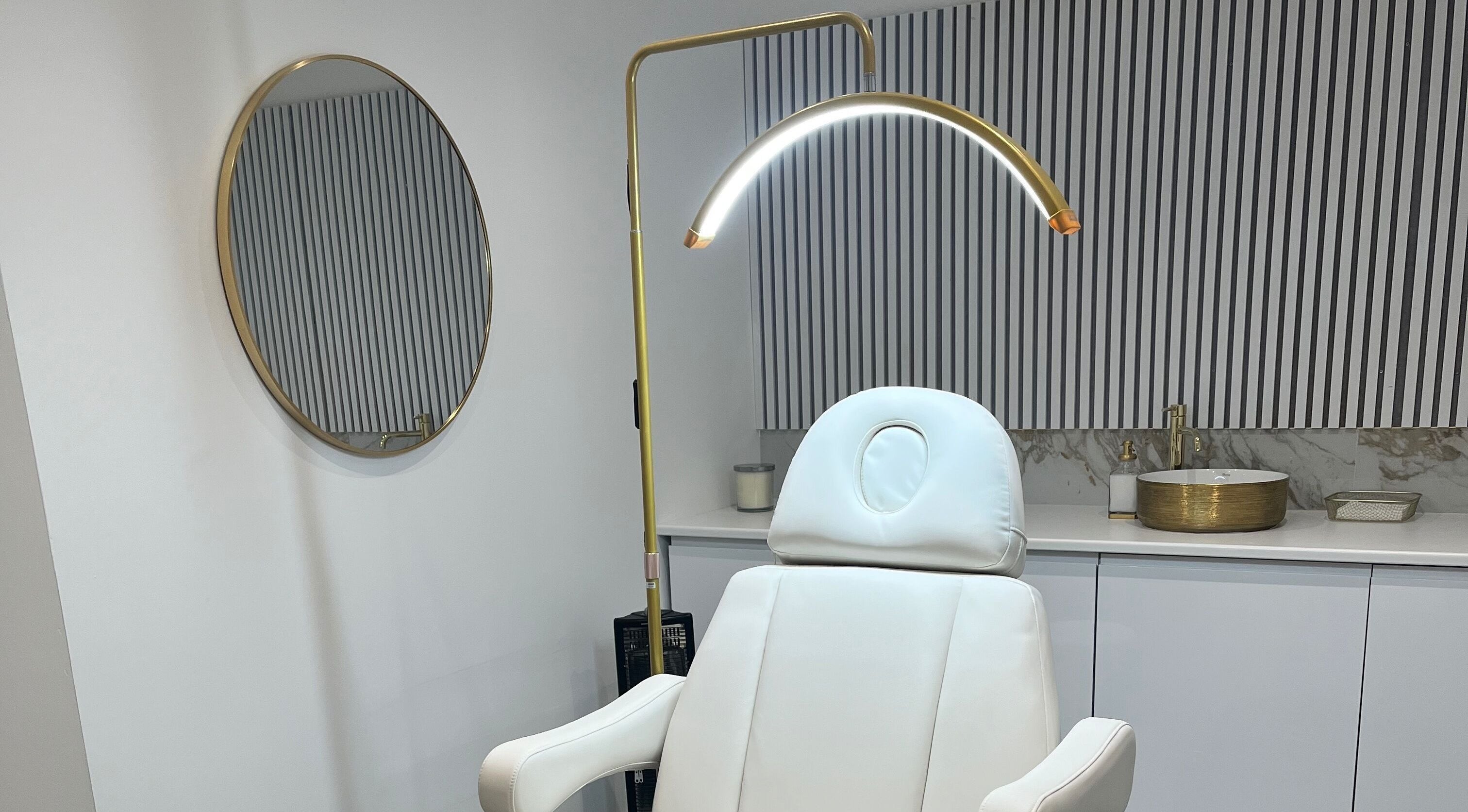 Modern treatment room at Renaissance Aesthetics, Sligo, County Sligo, IE with stylish decor and comfortable chair.